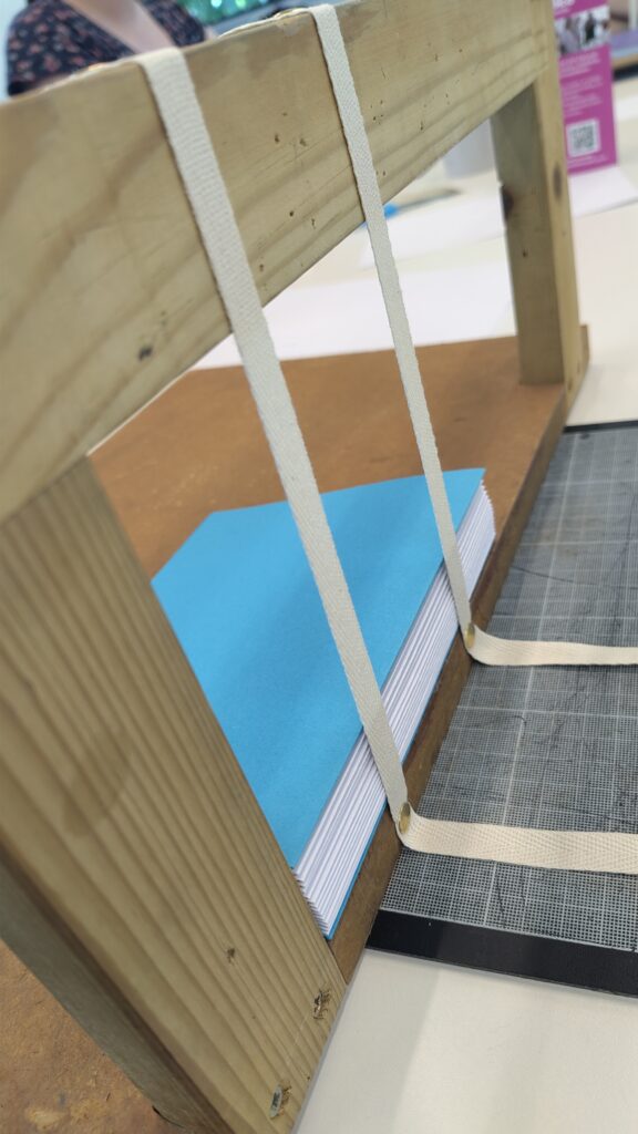 Picture of book block in sewing frame